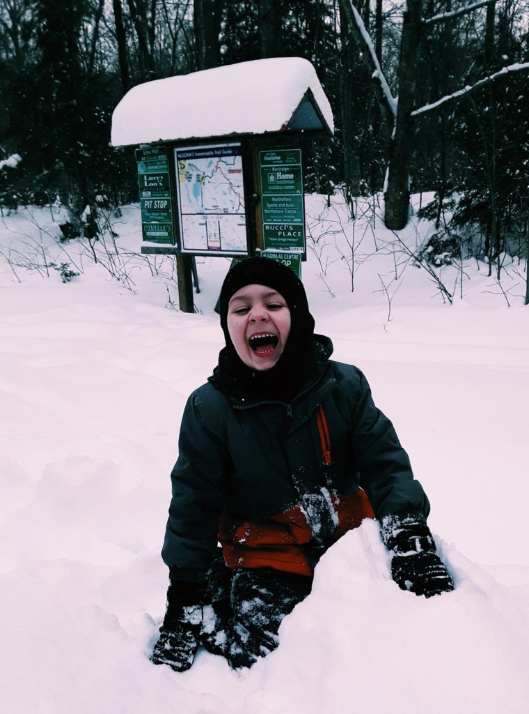 Child having fun in the snow