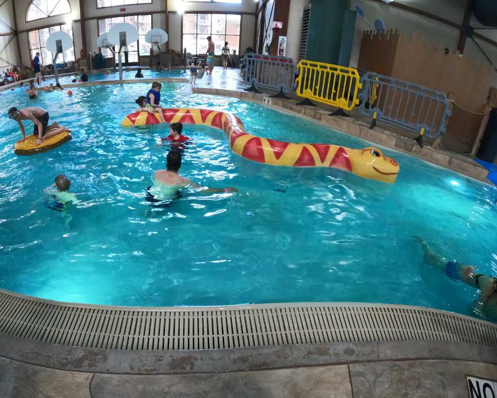 A pool called Chinook Cove with a giant floating water snake at Great Wolf Lodge, Traverse City.