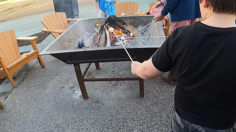 Roasting marshmallows in spring at Boyne Mountain Resort.