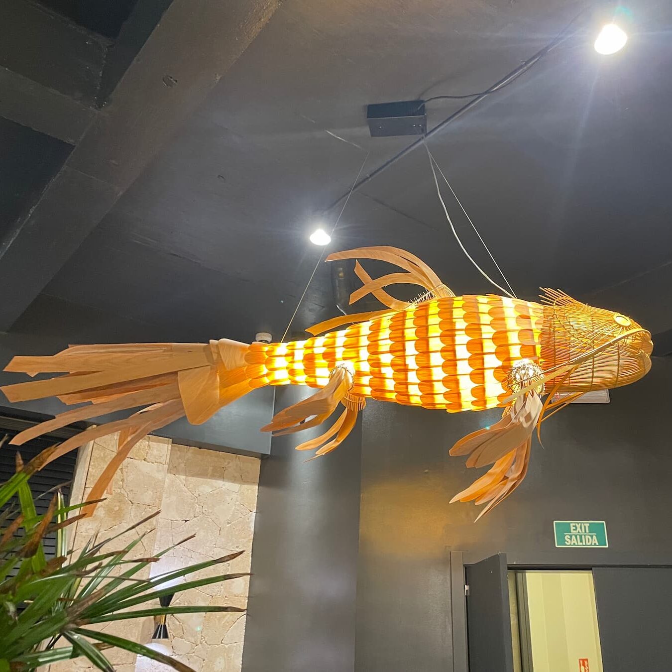 Stylish interior decor of Himitsu restaurant at Dreams Flora featuring modern Asian-inspired design with warm lighting and sleek wood accents.