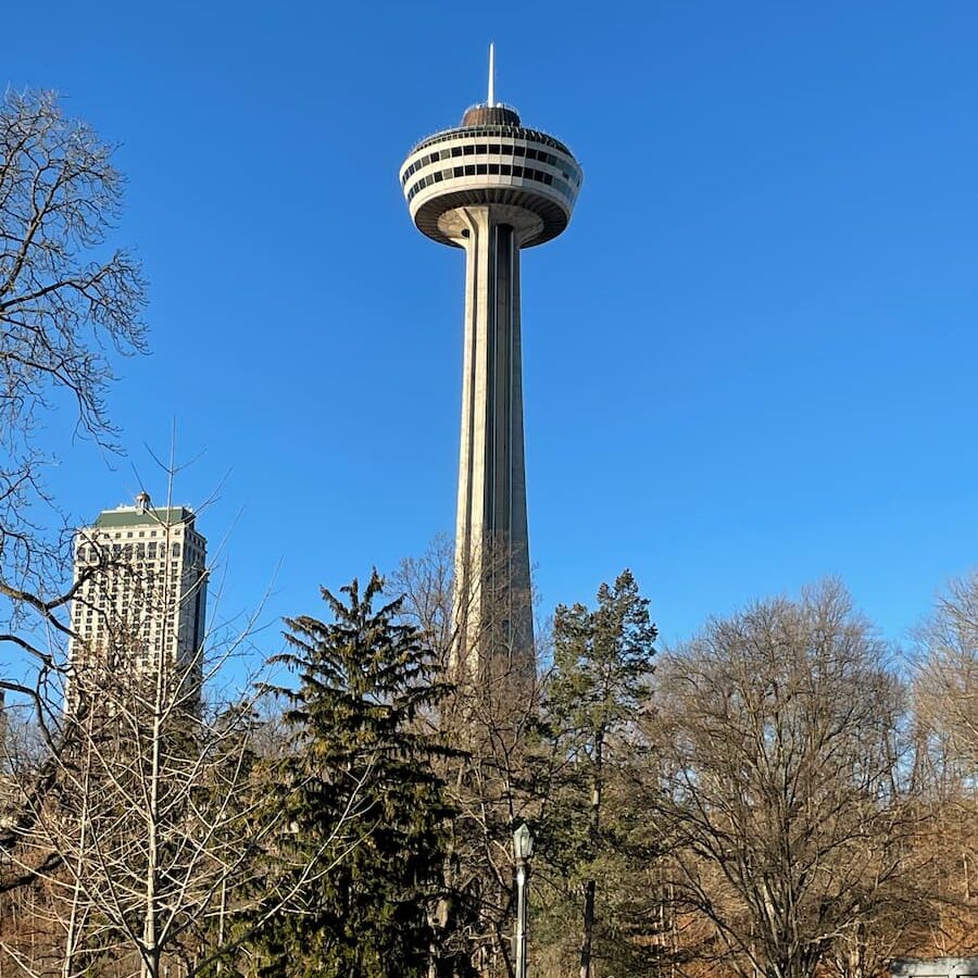 Skylon Tower in Niagara Falls with observation deck and revolving restaurant overlooking the city and waterfalls.