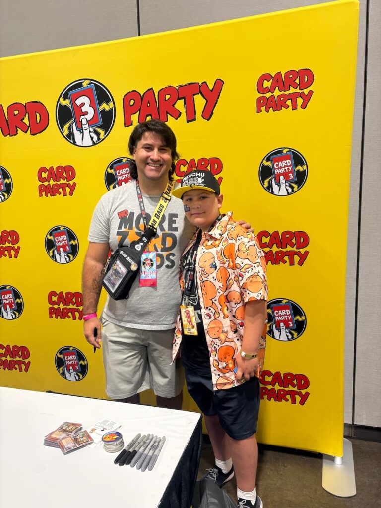 Fan meeting Gonzo at Card Party 3 in Tampa, smiling together for a photo in the energetic convention atmosphere.
