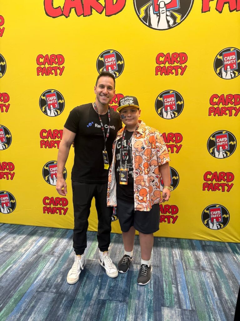 Fan posing with Leonhart at Card Party 3 in Tampa, both smiling and enjoying the Pokémon-themed celebration.